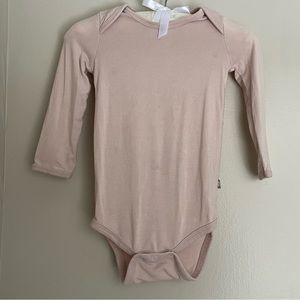 Kyte Baby Long Sleeve Bodysuit in Blush, size 6-12months